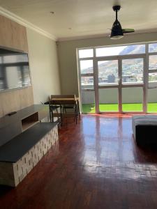 a living room with a couch and a table at 7 on Sachs in Cape Town +11 photos