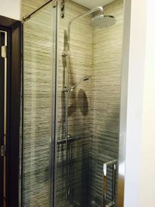 a shower with a glass door in a bathroom at Calle Mayor 21 VUT1222AS in Llanes