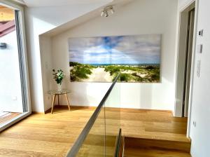 a room with a picture of a beach on the wall at Gmunden Skyline in Gmunden