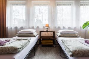 Łóżko lub łóżka w pokoju w obiekcie Apartament gościnny