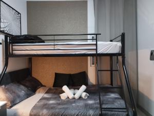 a bunk bed with two pillows on top of it at Vilapicina Hostal in Barcelona