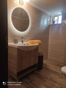 a bathroom with a sink and a mirror at Lila's house in Eleoúsa +39 photos