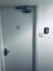 a door with two tools on top of it at Stylish Town House - Modern double room - 3 in Parkside