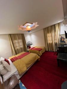 Katil atau katil-katil dalam bilik di Hotel Kasbah Asmaa