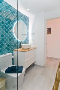 a bathroom with a sink and a mirror at Luxury Buenavista Famara in Famara