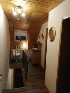 a hallway of a room with a kitchen and a table at Haus Oldenburg in Lauterecken