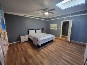 a bedroom with a bed and a ceiling fan at Sun Angel House #2 Pahrump in Pahrump