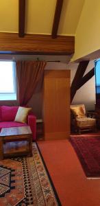 a living room with a couch and a window at Maisonette Elisabeth in Trier
