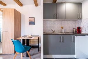 Kuchyňa alebo kuchynka v ubytovaní Un refuge douillet et moderne au cœur d'Audincourt