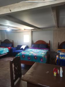 A bed or beds in a room at Casa del bosque