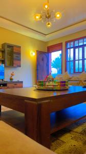 a dining room with a table with a plate of food on it at Villa Marrakech in Marrakesh