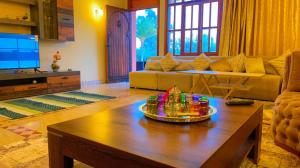 a living room with a couch and a coffee table at Villa Marrakech in Marrakesh