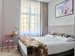 Posteľ alebo postele v izbe v ubytovaní HOLA GDYNIA