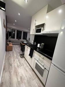 Kjøkken eller kjøkkenkrok på Amazing cosy flat Lux Gare