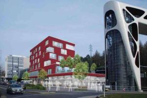 un rendimiento de un edificio con un edificio rojo en Amazing Hyper Central Flat- Esch, en Esch-sur-Alzette