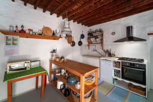 A kitchen or kitchenette at Casa Angelina Lindian House with large garden