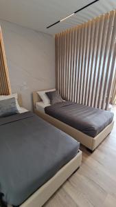 Postel nebo postele na pokoji v ubytování Apartments Tomislav