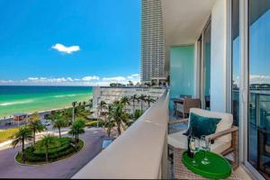 a balcony with a view of the beach and the ocean at Amazing apartment- Hyde Beach Resort in Hollywood