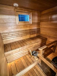 an overhead view of a wooden sauna with a window at Vuokatin kultaranta in Sotkamo