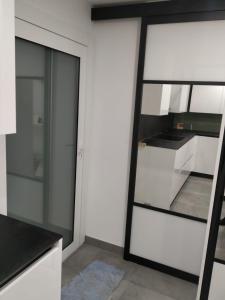 Kuchyňa alebo kuchynka v ubytovaní Résidence Odalys Saint Loup Appartement Climatisé entierement rénové