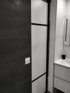 a bathroom with a toilet and a sink at Résidence Odalys Saint Loup Appartement Climatisé entierement rénové in Cap d'Agde