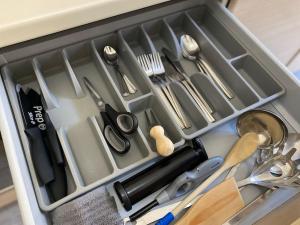 a drawer full of kitchen utensils in a drawer at Short Stay Pavia nuovo in città in Pavia