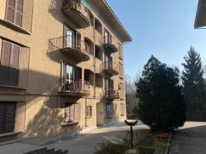 a building with balconies on the side of it at Short Stay Pavia nuovo in città in Pavia