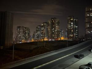 a city skyline at night with a highway at Parvaneh in Buyukcekmece