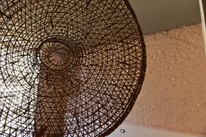 a ceiling with a metal structure in a building at Palais La Nasse in Sanremo