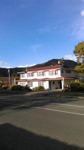 a large white building with a street in front of it at Stonehaven Motel in Whangarei