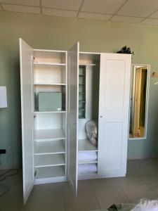 Posteľ alebo postele v izbe v ubytovaní BOTANICAL SUITE