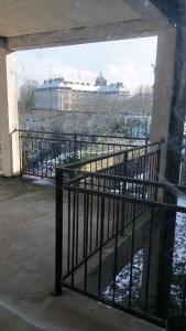 a balcony with a fence and a view of a building at gite du chateau de champlitte in Champlitte-et-le-Prélot