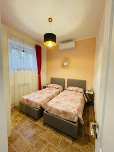 Кровать или кровати в номере Maddy house - 50 mt dal mare