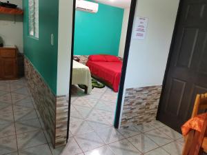 Кровать или кровати в номере Cabinas Mitchaelle's
