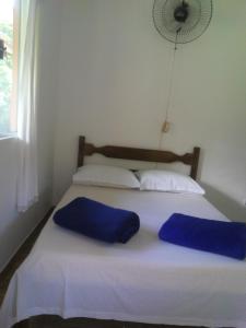 Ένα ή περισσότερα κρεβάτια σε δωμάτιο στο Casa Cachoeira Crepúsculo