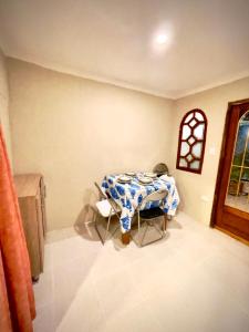 a dining room table with a blue and white table cloth at Casona La Española in Cartagena de Indias