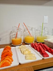 a table with two plates of food and glasses of orange juice at Arcos Palace Hotel in Arcos