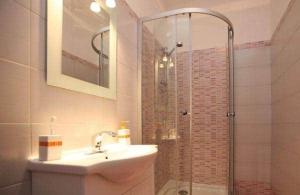 a bathroom with a sink and a shower with a sink at Apartment with pool Adria in Marčana +4 photos