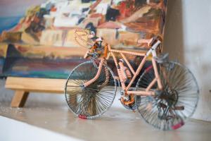 a couple of bikes parked next to a painting at Lady of Hydra Villa, sea front view, private beach in Hydra