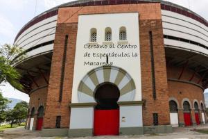 a building with a sign on the side of it at HABITACION AMOBLADA SECTOR LAURELES-ESTADIO #1 Madrid in Medellín +1 photo