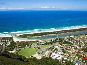 an aerial view of a beach and the ocean at Original Surf Cottage in heart of Pottsville Beach in Pottsville