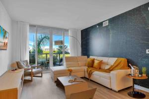 a living room with a couch and a table at Modern apartment in luxury condominium AB- 2 bed/2 ba in Hallandale Beach