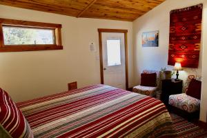 Voodi või voodid majutusasutuse Red Moon Lodge toas
