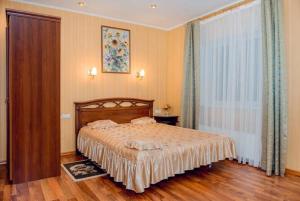 En eller flere senge i et værelse på Hotel Vivat Provincia