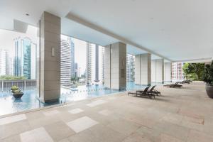 a view of a building with tables and chairs at Atelier Bukit Bintang in Kuala Lumpur +18 photos
