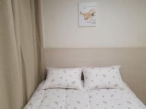 a bed with a comforter with a dog on it at AREX Hongik univ Unit 201 in Seoul