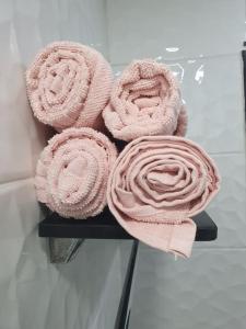 a bunch of pink towels sitting on a shelf at AREX Hongik univ Unit 201 in Seoul