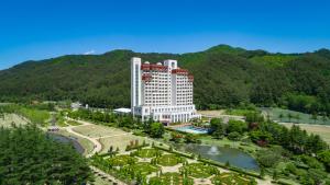 a large building with a park in front of it at Kensington Hotel Pyeongchang in Pyeongchang 