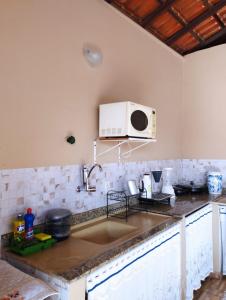 Cuisine ou kitchenette dans l'établissement Casa temporada Cocal/Praia de Itaparica-Vila Velha