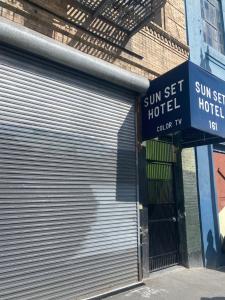 a garage door with a sun set hotel sign on it at SUNSET HOTEL - Downtown San Francisco in San Francisco